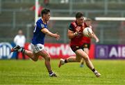 10 June 2023; Ceilum Doherty of Down in action against Joe Hagan of Longford during the Tailteann Cup Preliminary Quarter Final match between Down and Longford at Pairc Esler in Newry, Down. Photo by Daire Brennan/Sportsfile