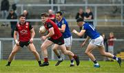 10 June 2023; Odhran Murdock of Down in action against Dylan Farrell of Longford during the Tailteann Cup Preliminary Quarter Final match between Down and Longford at Pairc Esler in Newry, Down. Photo by Daire Brennan/Sportsfile