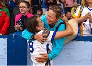 10 June 2023; A Wicklow player celebrates with a family member after the 2023 All-Ireland U14 Bronze Final match between Clare and Wicklow at McDonagh Park in Nenagh, Tipperary. Photo by Michael P Ryan/Sportsfile