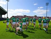 28 May 2023; Members of the Limerick squad go to their pre game positions after the traditional pre match team photograph before the Munster GAA Hurling Senior Championship Round 5 match between Limerick and Cork at TUS Gaelic Grounds in Limerick. Photo by Ray McManus/Sportsfile