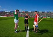 28 May 2023; Referee James Owens tosses a coin between the Cork, Sean O'Donoghue, and Limerick captain, Declan Hannon, before the Munster GAA Hurling Senior Championship Round 5 match between Limerick and Cork at TUS Gaelic Grounds in Limerick. Photo by Ray McManus/Sportsfile