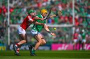 28 May 2023; Cathal O'Neill of Limerick is tackled by Brian Roche of Cork during the Munster GAA Hurling Senior Championship Round 5 match between Limerick and Cork at TUS Gaelic Grounds in Limerick. Photo by Ray McManus/Sportsfile