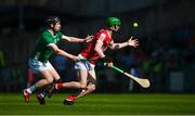 28 May 2023; Seamus Harnedy of Cork is tackled by Peter Casey of Limerick during the Munster GAA Hurling Senior Championship Round 5 match between Limerick and Cork at TUS Gaelic Grounds in Limerick. Photo by Ray McManus/Sportsfile