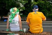 11 June 2023; A Limerick supporter, Lilly Mullane, and a Clare supporter, Tony Haugh, relax before making their way to the Munster GAA Hurling Championship Final match between Clare and Limerick at TUS Gaelic Grounds in Limerick. Photo by Ray McManus/Sportsfile
