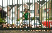 11 June 2023; A young Limerick supporter watches as his side get off the bus ahead of the Munster GAA Hurling Championship Final match between Clare and Limerick at TUS Gaelic Grounds in Limerick. Photo by Daire Brennan/Sportsfile