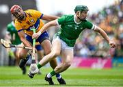 11 June 2023; William O'Donoghue of Limerick in action against Peter Duggan of Clare during the Munster GAA Hurling Championship Final match between Clare and Limerick at TUS Gaelic Grounds in Limerick. Photo by Eóin Noonan/Sportsfile