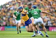 11 June 2023; Mark Rodgers of Clare is tackled by Gearoid Hegarty , left, and Michael Casey of Limerick during the Munster GAA Hurling Championship Final match between Clare and Limerick at TUS Gaelic Grounds in Limerick. Photo by Eóin Noonan/Sportsfile