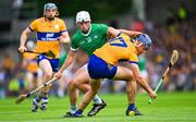 11 June 2023; Cian Nolan of Clare is tackled by Aaron Gillane of Limerick during the Munster GAA Hurling Championship Final match between Clare and Limerick at TUS Gaelic Grounds in Limerick. Photo by Ray McManus/Sportsfile