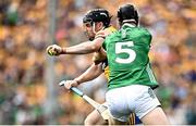 11 June 2023; Tony Kelly of Clare is tackled by Diarmaid Byrnes of Limerick during the Munster GAA Hurling Championship Final match between Clare and Limerick at TUS Gaelic Grounds in Limerick. Photo by Eóin Noonan/Sportsfile