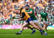 11 June 2023; John Conlon of Clare in action against David Reidy of Limerick during the Munster GAA Hurling Championship Final match between Clare and Limerick at TUS Gaelic Grounds in Limerick. Photo by Daire Brennan/Sportsfile