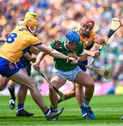 11 June 2023; Michael Casey of Limerick in action against David Fitzgerald, left, and Peter Duggan of Clare during the Munster GAA Hurling Championship Final match between Clare and Limerick at TUS Gaelic Grounds in Limerick. Photo by Daire Brennan/Sportsfile