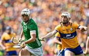 11 June 2023; Kyle Hayes of Limerick in action against Ryan Taylor of Clare during the Munster GAA Hurling Championship Final match between Clare and Limerick at TUS Gaelic Grounds in Limerick. Photo by Eóin Noonan/Sportsfile