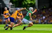 11 June 2023; Aaron Gillane of Limerick is tackled by Cian Nolan of Clare during the Munster GAA Hurling Championship Final match between Clare and Limerick at TUS Gaelic Grounds in Limerick. Photo by Ray McManus/Sportsfile
