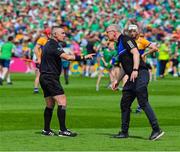11 June 2023; Clare manager Brian Lohan speaks to referee Liam Gordon during the Munster GAA Hurling Championship Final match between Clare and Limerick at TUS Gaelic Grounds in Limerick. Photo by Ray McManus/Sportsfile