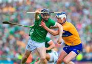 11 June 2023; Graeme Mulcahy of Limerick is tackled by Diarmuid Ryan of Clare during the Munster GAA Hurling Championship Final match between Clare and Limerick at TUS Gaelic Grounds in Limerick. Photo by Ray McManus/Sportsfile