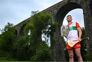 13 June 2023; Brian Tracey of Carlow poses for a portrait with the Liam MacCarthy cup at the 2023 GAA Hurling All-Ireland Series national launch at Kilmacthomas Viaduct in Waterford. Photo by Brendan Moran/Sportsfile