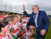 13 June 2023; At the 2023 GAA Hurling All-Ireland Series national launch at De La Salle GAA Club in Waterford is Uachtarán Chumann Lúthchleas Gael Larry McCarthy with children from the 9 to 10 year old players of the host club De La Salle. Photo by Ray McManus/Sportsfile