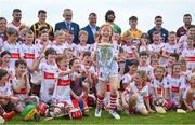 13 June 2023; De La Salle GAA Club player Millie Furlong holds the Liam MacCarthy Cup aloft in the company of her 9 to10 year old clubmates, and from left, Brian Tracey of Carlow, Richie Reid of Kilkenny, Uachtarán Chumann Lúthchleas Gael Larry McCarthy, De La Salle club chairman Don Lalor, Ben Connelly of Offaly, Adam Hogan of Clare, Seán Brennan of Dublin and Padraic Mannion of Galway, at the 2023 GAA Hurling All-Ireland Series national launch at De La Salle GAA Club in Waterford. Photo by Brendan Moran/Sportsfile