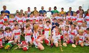 13 June 2023; At the 2023 GAA Hurling All-Ireland Series national launch at De La Salle GAA Club in Waterford are Cathal O’Neill of Limerick, Noel McGrath of Tipperary, Brian Tracey of Carlow, Richie Reid of Kilkenny, Uachtarán Chumann Lúthchleas Gael Larry McCarthy, De La Salle club chairman Don Lalor, Ben Connelly of Offaly, Adam Hogan of Clare, Seán Brennan of Dublin, Padraic Mannion of Galway and members of the De La Salle GAA Club 9 to 10 year old players including Jeffrey Wyse holding the Liam MacCarthy Cup aloft. Photo by Ray McManus/Sportsfile