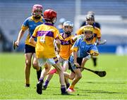 13 June 2023; Fionn O'Brien of St Mary's BNS Rathfarnham in action against James Walsh, 3, and Alex Sorohan of St Laurence's BNS Kilmacud during the Corn Herald Final at the Allianz Cumann na mBunscol Finals at Croke Park. Photo by Piaras Ó Mídheach/Sportsfile