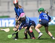 13 June 2023; Anna Duggan of Pope John Paul II NS Malahide, centre, in action against Ellie Gallagher of St Attracta's SNS Dundrum during the Corn Olly Quinlan Final at the Allianz Cumann na mBunscol Finals at Croke Park. Photo by Piaras Ó Mídheach/Sportsfile