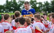 13 June 2023; Noel McGrath of Tipperary signs autographs for young players at the 2023 GAA Hurling All-Ireland Series national launch at De La Salle GAA Club in Waterford. Photo by Brendan Moran/Sportsfile