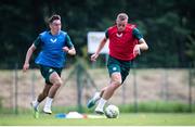 14 June 2023; Killian Phillips, right, in action against Darragh Burns during a Republic of Ireland training session at Parktherme-Arena Bad Radkersburg in Austria. Photo by Blaz Weindorfer/Sportsfile