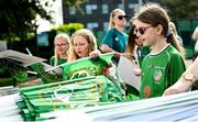 16 June 2023; Supporters collect merchandise before a Republic of Ireland women open training session at UCD Bowl in Dublin. Photo by Ramsey Cardy/Sportsfile