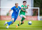 16 June 2023; Andy Moran of Republic of Ireland in action against Viunnyk Bohdan of Ukraine during the U21 International friendly match between Ukraine and the Republic of Ireland at Union Sport-Club, Blamau in Bad Blamau, Austria. Photo by Blaz Weindorfer/Sportsfile