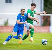 16 June 2023; Andy Moran of Republic of Ireland in action against Viunnyk Bohdan of Ukraine during the U21 International friendly match between Ukraine and the Republic of Ireland at Union Sport-Club, Blamau in Bad Blamau, Austria. Photo by Blaz Weindorfer/Sportsfile