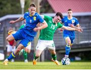 16 June 2023; Andy Moran of Republic of Ireland in action against Danylo Sikan of Ukraine during the U21 International friendly match between Ukraine and the Republic of Ireland at Union Sport-Club, Blamau in Bad Blamau, Austria. Photo by Blaz Weindorfer/Sportsfile