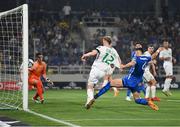 16 June 2023; Nathan Collins of Republic of Ireland scores his side's first goal, under pressure from Konstantinos Mavropanos of Greece, during the UEFA EURO 2024 Championship qualifying group B match between Greece and Republic of Ireland at the OPAP Arena in Athens, Greece. Photo by Seb Daly/Sportsfile