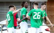 16 June 2023; Bosun Lawal of Republic of Ireland, centre, celebrates with teammates after scoring his side's second goal during the U21 International friendly match between Ukraine and the Republic of Ireland at Union Sport-Club, Blamau in Bad Blamau, Austria. Photo by Blaz Weindorfer/Sportsfile
