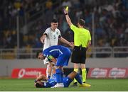 16 June 2023; Referee Harald Lechner shows the yellow card to John Egan of Republic of Ireland during the UEFA EURO 2024 Championship qualifying group B match between Greece and Republic of Ireland at the OPAP Arena in Athens, Greece. Photo by Stephen McCarthy/Sportsfile