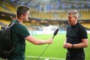 16 June 2023; Republic of Ireland manager Stephen Kenny is interviewed by Kieran Crowley, FAI communications manager, before the UEFA EURO 2024 Championship qualifying group B match between Greece and Republic of Ireland at the OPAP Arena in Athens, Greece. Photo by Stephen McCarthy/Sportsfile
