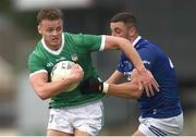 17 June 2023; Brian Donovan of Limerick is tackled by Robert Pigott of Laois during the Tailteann Cup Quarter Final match between Limerick and Laois at TUS Gaelic Grounds in Limerick. Photo by Tom Beary/Sportsfile