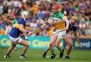 17 June 2023; Charlie Mitchell of Offaly in action against Bryan O'Meara, left, and Ronan Maher of Tipperary during the GAA Hurling All-Ireland Senior Championship Preliminary Quarter Final match between Offaly and Tipperary at Glenisk O'Connor Park in Tullamore, Offaly. Photo by Michael P Ryan/Sportsfile