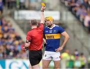 17 June 2023; Seamus Callanan of Tipperary is shown a yellow card by referee Johnny Murphy during the GAA Hurling All-Ireland Senior Championship Preliminary Quarter Final match between Offaly and Tipperary at Glenisk O'Connor Park in Tullamore, Offaly. Photo by Michael P Ryan/Sportsfile