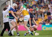 17 June 2023; Paddy Clancy of Offaly in action against goalkeeper Rhys Shelly and Michael Breen of Tipperary during the GAA Hurling All-Ireland Senior Championship Preliminary Quarter Final match between Offaly and Tipperary at Glenisk O'Connor Park in Tullamore, Offaly. Photo by Michael P Ryan/Sportsfile