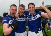 17 June 2023; Laois players, from left, Eoin Lowry, Sean O'Flynn and James Finn of Laois celebrate after the Tailteann Cup Quarter Final match between Limerick and Laois at TUS Gaelic Grounds in Limerick. Photo by Tom Beary/Sportsfile