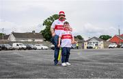 17 June 2023; Paul Irwin and Carraig Conway, age 9, from Ballinascreen before the GAA Football All-Ireland Senior Championship Round 3 match between Derry and Clare at Glennon Brothers Pearse Park in Longford. Photo by Stephen Marken/Sportsfile