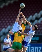 17 June 2023; Monaghan players, Darren Hughes, left, and Gary Mohan, compete for the throw-in against Donegal players, Hugh McFadden, 9, and Caolan McGonagle during the GAA Football All-Ireland Senior Championship Round 3 match between Monaghan and Donegal at O'Neills Healy Park in Omagh, Tyrone. Photo by Ramsey Cardy/Sportsfile