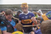 17 June 2023; Jake Morris of Tipperary signs autographs for supporters after the GAA Hurling All-Ireland Senior Championship Preliminary Quarter Final match between Offaly and Tipperary at Glenisk O'Connor Park in Tullamore, Offaly. Photo by Michael P Ryan/Sportsfile
