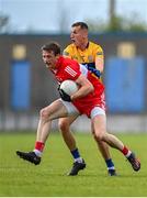 17 June 2023; Brendan Rogers of Derry in action against Emmet McMahon of Clare during the GAA Football All-Ireland Senior Championship Round 3 match between Derry and Clare at Glennon Brothers Pearse Park in Longford. Photo by Stephen Marken/Sportsfile
