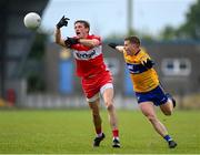 17 June 2023; Brendan Rogers of Derry in action against Pádraic Collins of Clare during the GAA Football All-Ireland Senior Championship Round 3 match between Derry and Clare at Glennon Brothers Pearse Park in Longford. Photo by Stephen Marken/Sportsfile