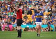 17 June 2023; Referee Johnny Murphy signals for a penalty as Dan McCormack of Tipperary leaves the field after being shown a black card during the GAA Hurling All-Ireland Senior Championship Preliminary Quarter Final match between Offaly and Tipperary at Glenisk O'Connor Park in Tullamore, Offaly. Photo by Michael P Ryan/Sportsfile