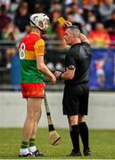 17 June 2023; Jack Kavanagh of Carlow is shown a yellow card by referee James Owens during the GAA Hurling All-Ireland Senior Championship Preliminary Quarter Final match between Carlow and Dublin at Netwatch Cullen Park in Carlow. Photo by Sam Barnes/Sportsfile