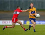 17 June 2023; Pearse Lillis of Clare in action against Ciaran McFaul of Derry during the GAA Football All-Ireland Senior Championship Round 3 match between Derry and Clare at Glennon Brothers Pearse Park in Longford. Photo by Stephen Marken/Sportsfile