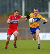 17 June 2023; Benny Heron of Derry in action against Ciaran Russell of Clare during the GAA Football All-Ireland Senior Championship Round 3 match between Derry and Clare at Glennon Brothers Pearse Park in Longford. Photo by Stephen Marken/Sportsfile