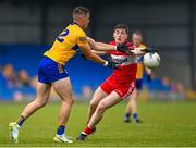 17 June 2023; Jamie Malone of Clare in action against Padraig McGrogan of Derry during the GAA Football All-Ireland Senior Championship Round 3 match between Derry and Clare at Glennon Brothers Pearse Park in Longford. Photo by Stephen Marken/Sportsfile